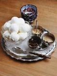 A tray with qahwa, dates and sweets