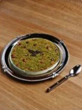 A pistachio tart on a silver plate