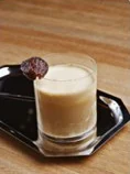 A creamy date coffee topped with a date