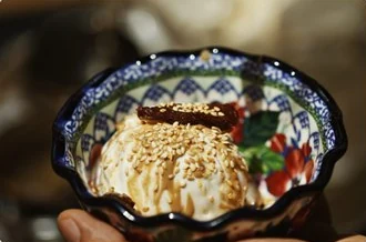 A dessert bowl topped with sesame