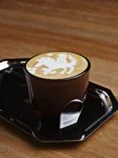 A Shalwa latte with the falcon drawn in the foam
