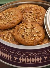 Nut-topped cookies in the plum Shalwa tin