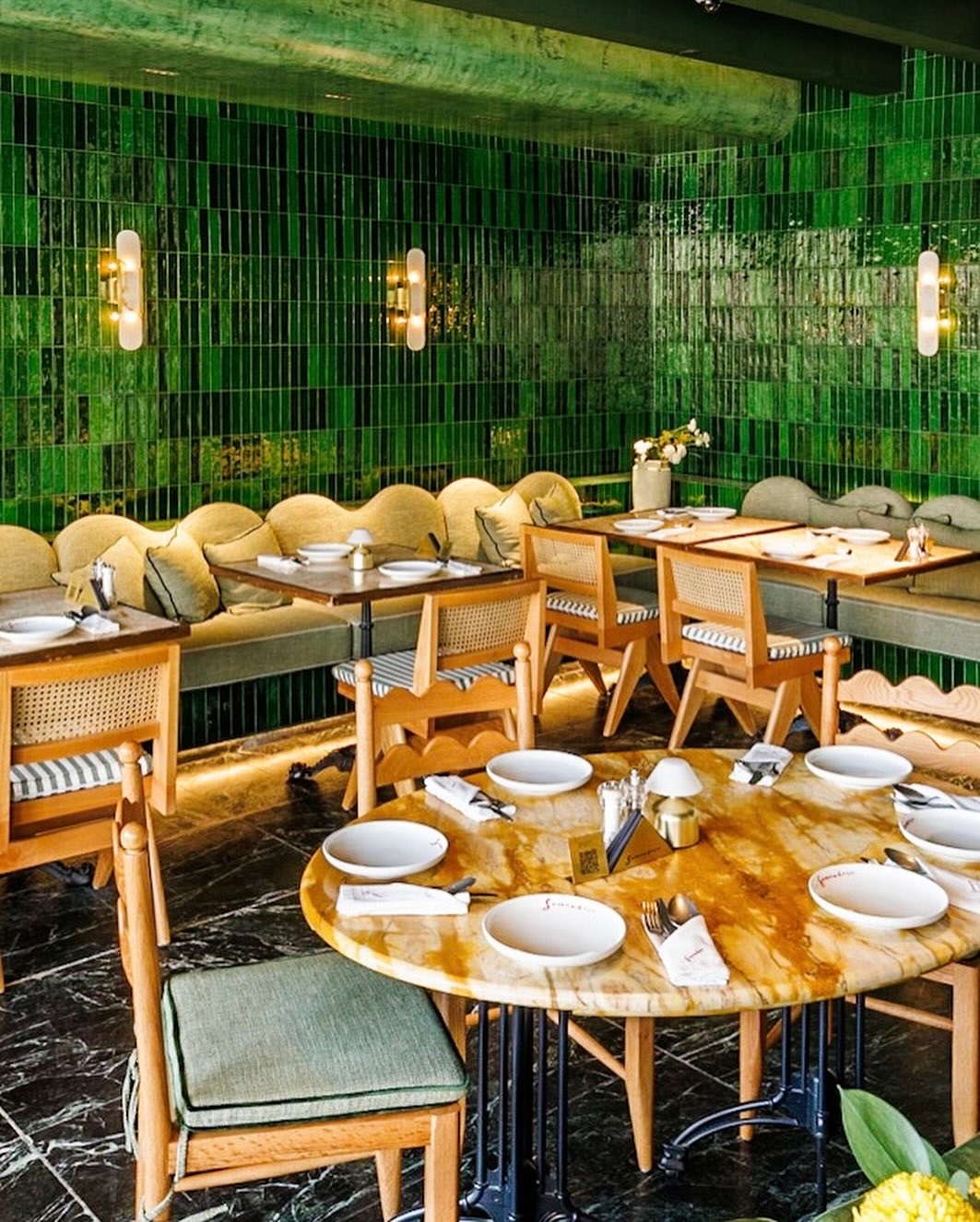 Green tiled dining room at Somewhere Al Bujairi