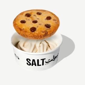 A chocolate-chip cookie on a SALT cup of soft serve